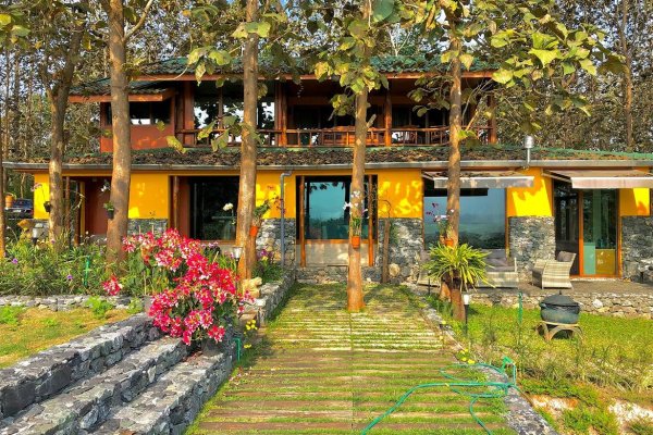 A 12 rai teakwood estate with luxury residence is for sale in Phrao area of Chiang Mai