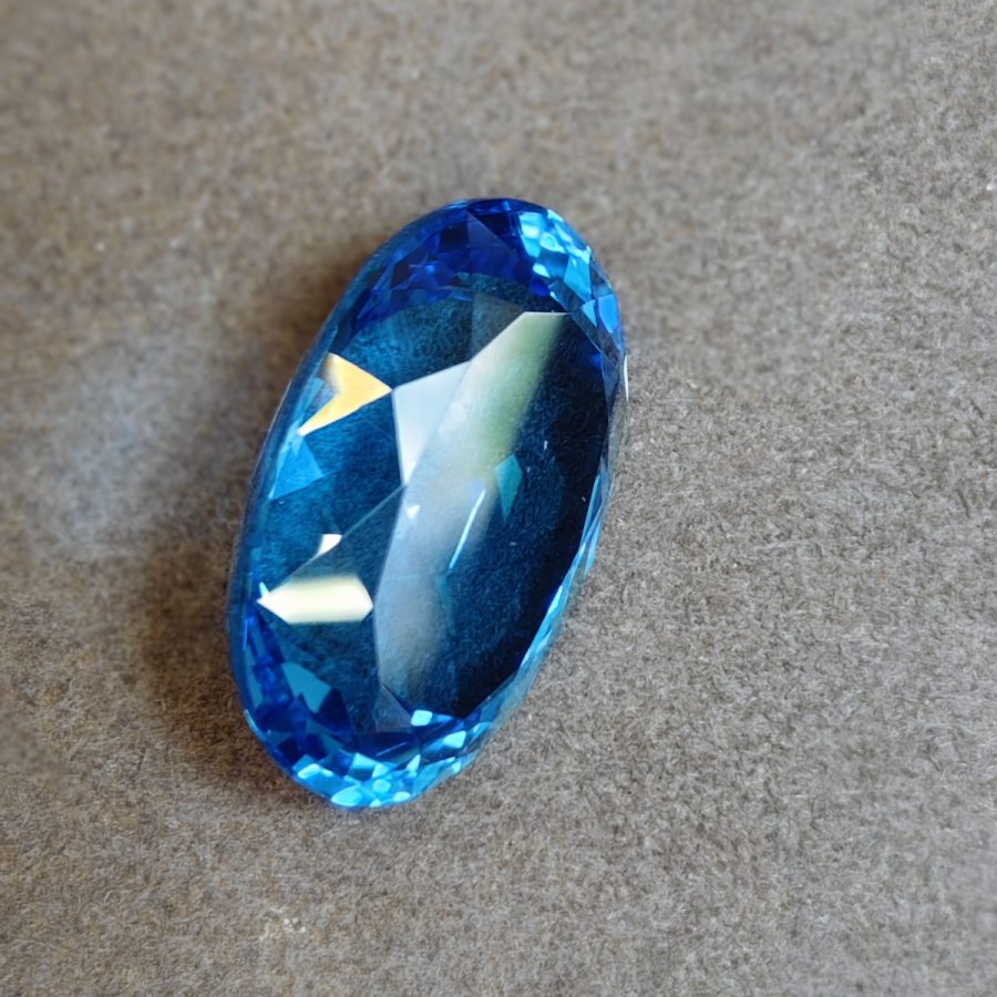 Swiss Blue Topaz, Oval Faceted, 27.23 ct — AIG Certified