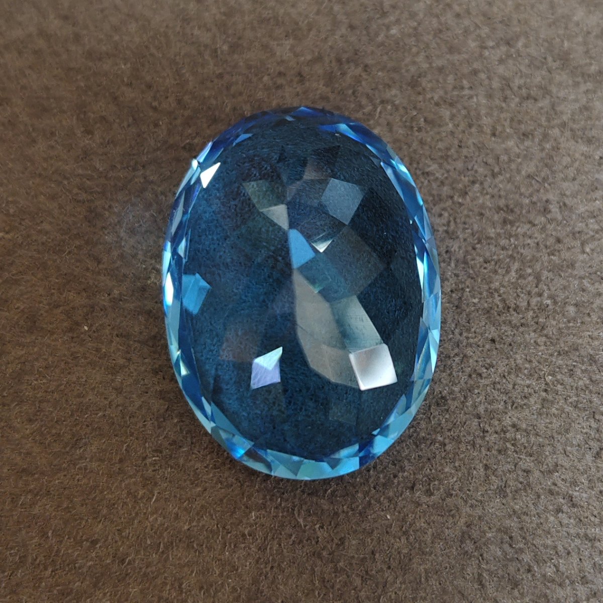 Swiss Blue Topaz, Oval Faceted, 31.37 ct — AIG Certified