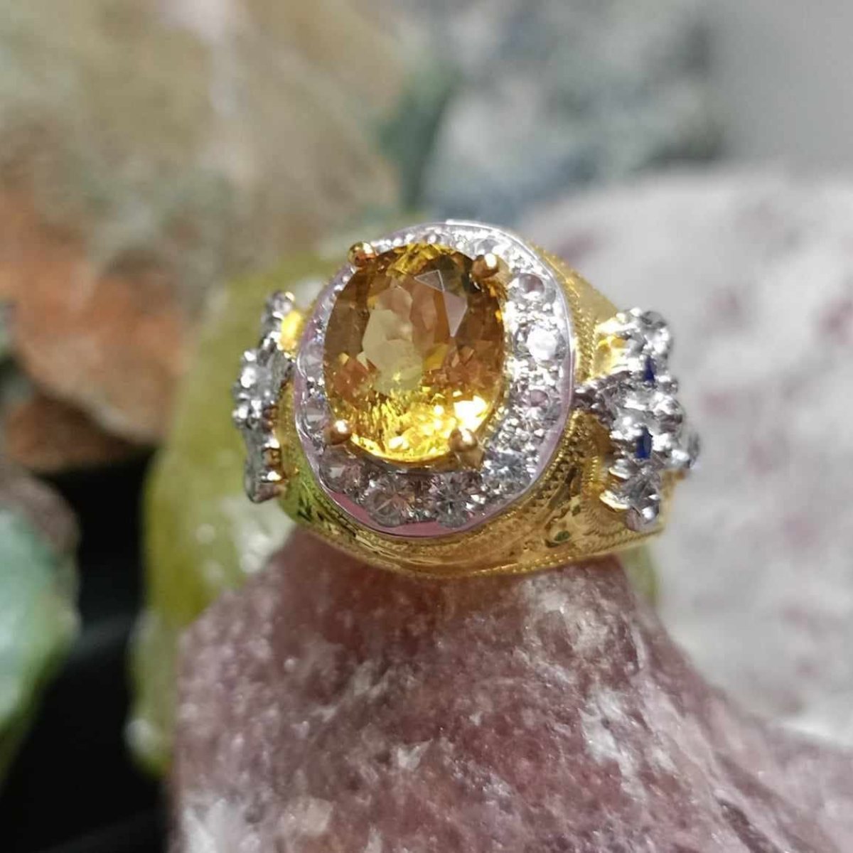 Yellow gemstone ring with halo setting