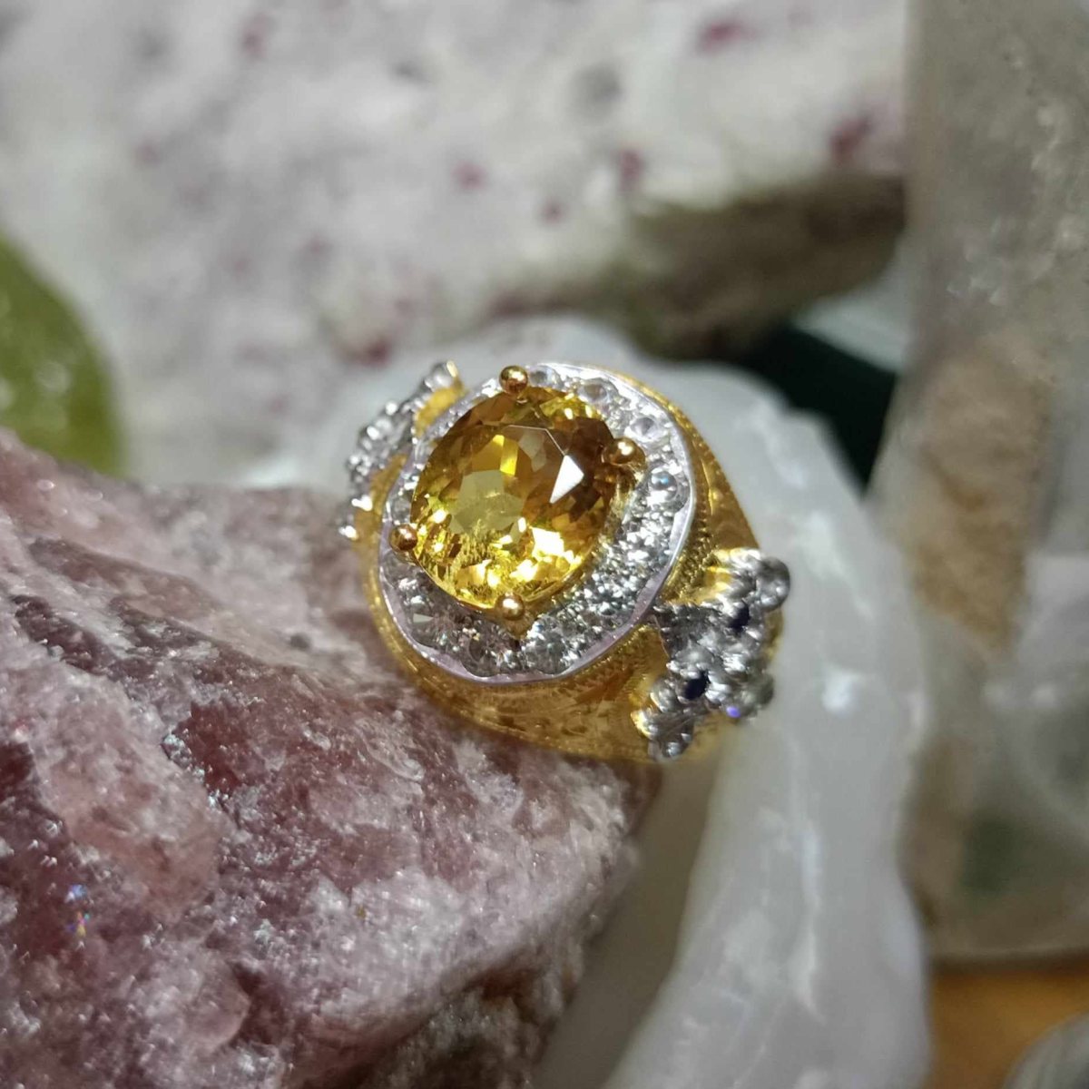 Cut yellow gemstone, gold-tone setting